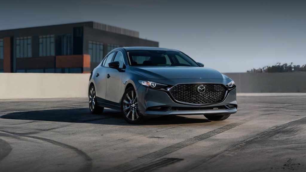 Gray Mazda3 sedan parked outdoors.